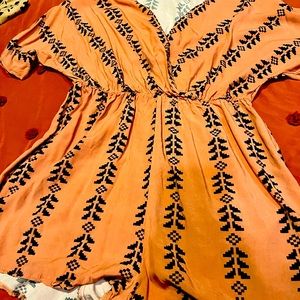 Adorable romper- perfect for summer! Dusty pink with a belt to cinch the waist!